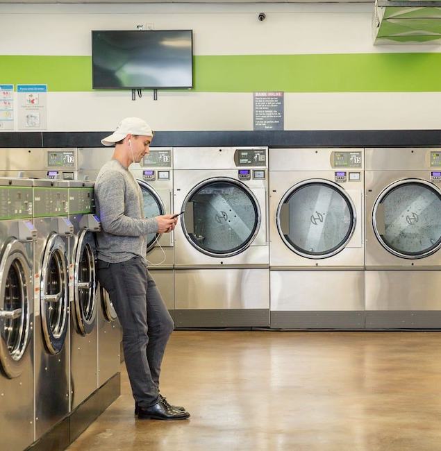What are the machines that customers flock to in a vended laundry and why?